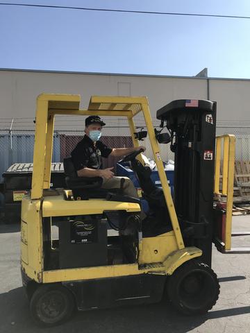 Tom Bruggemann driving the fork lift