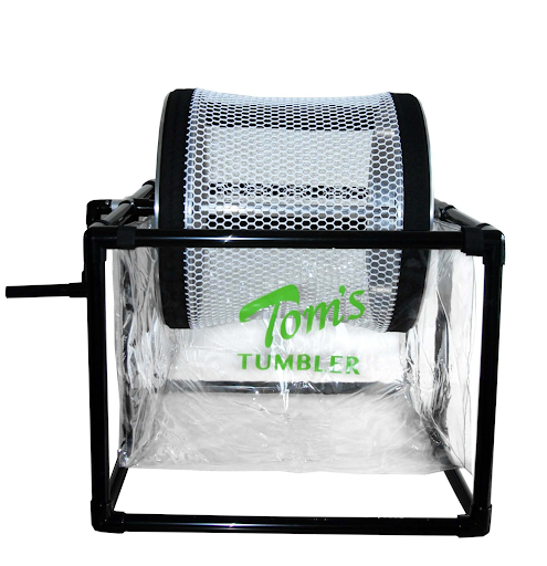 A picture of a hand-cranked tumble trimmer